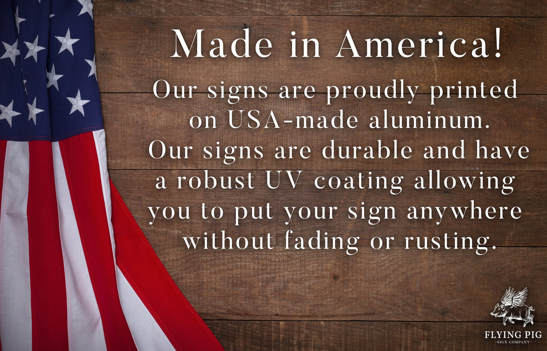 a wooden sign with an american flag on it