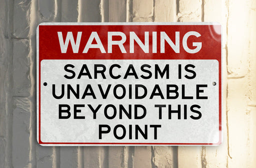 a red and white sign on a white wall