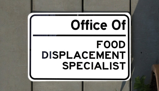 a white sign with black writing on it