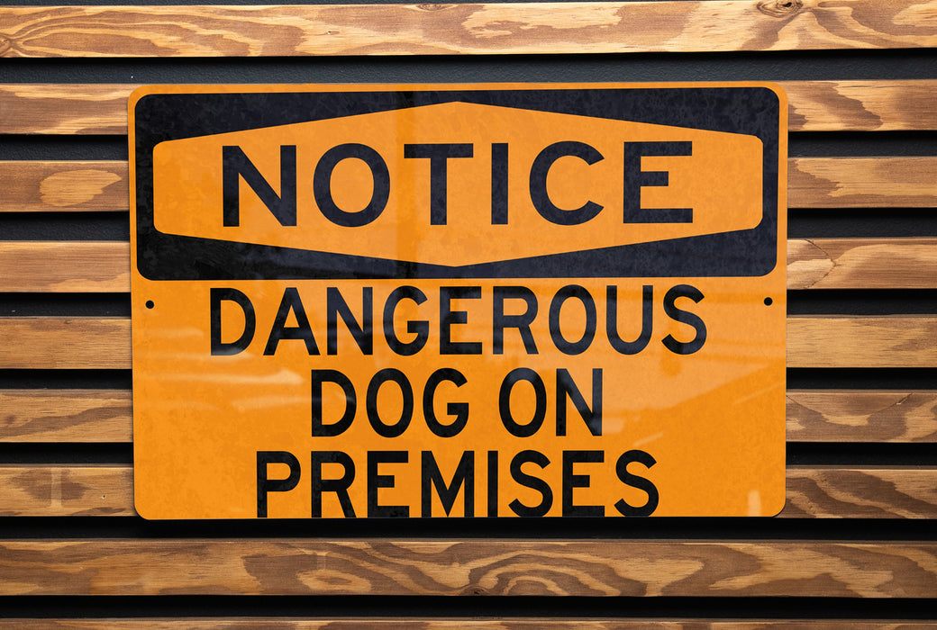 a close up of a street sign on a wooden wall