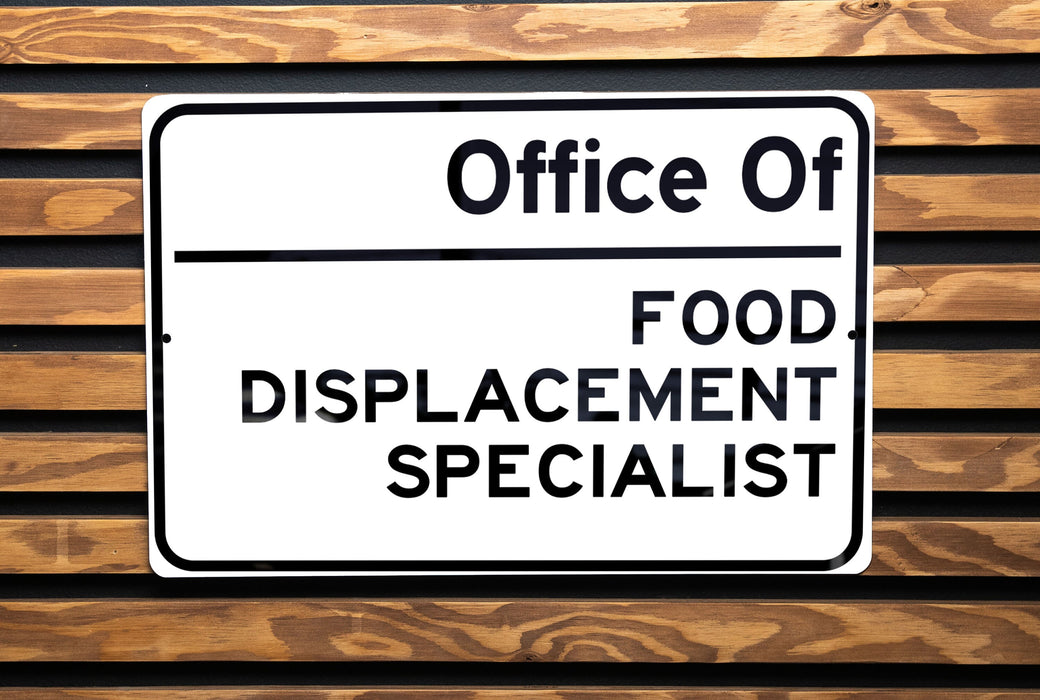 a white sign on a wooden bench that says, oucce 01