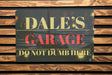 a close up of a sign on a wooden bench