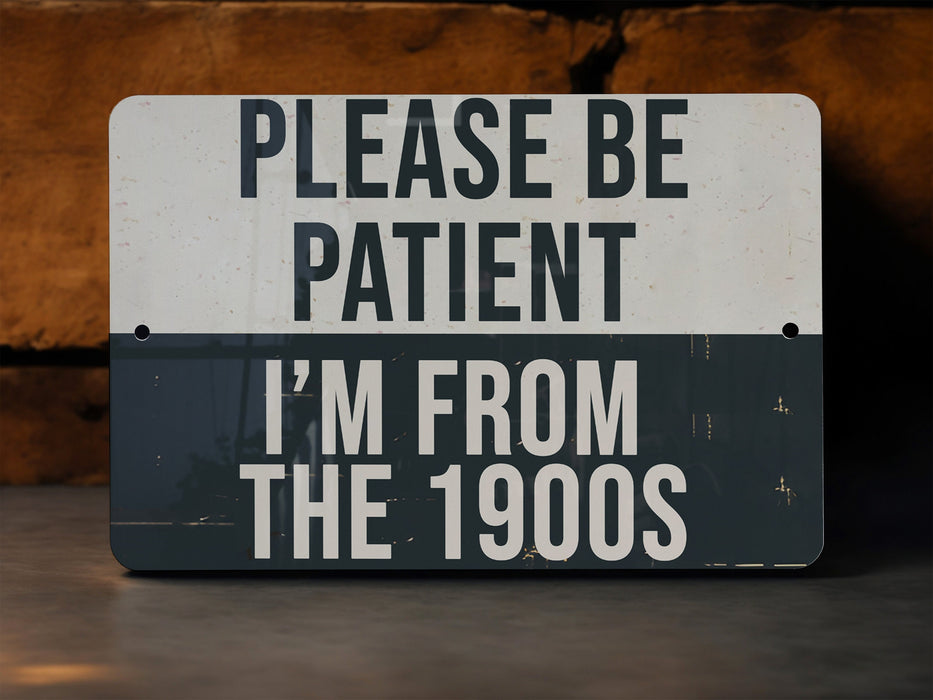 a sign that says please be patient i'm from the 1990s