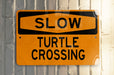 a close up of a street sign on a pole