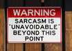 a red and white sign on a wooden fence