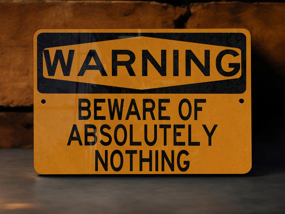 a warning sign on the ground warning of beware of absolutely nothing