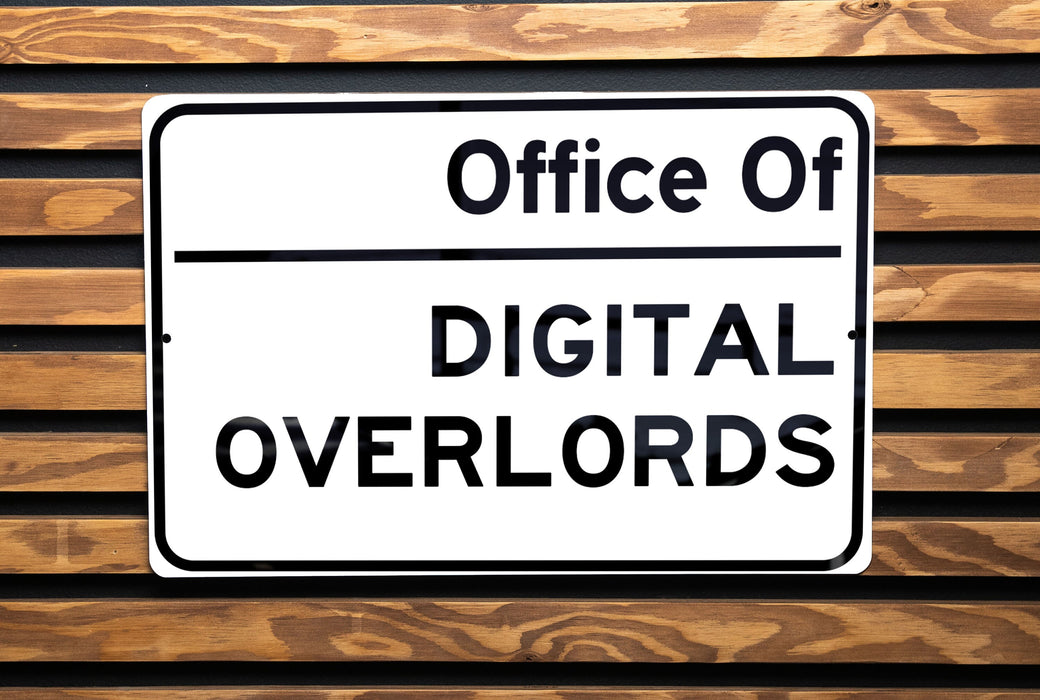 a street sign on a wooden bench in a park