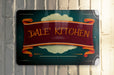a sign that says date kitchen hanging on a wall