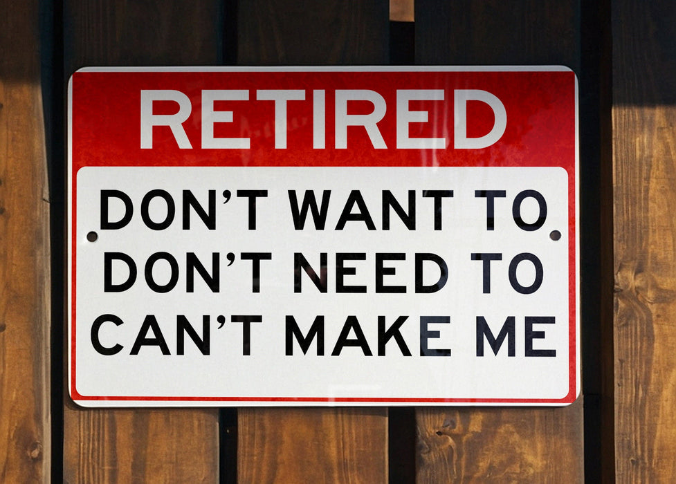 a red and white sign on a wooden fence