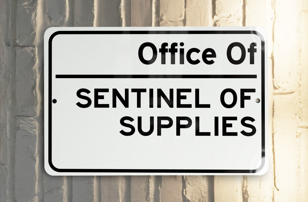 a white street sign hanging from the side of a building