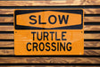 a close up of a street sign on a wooden surface