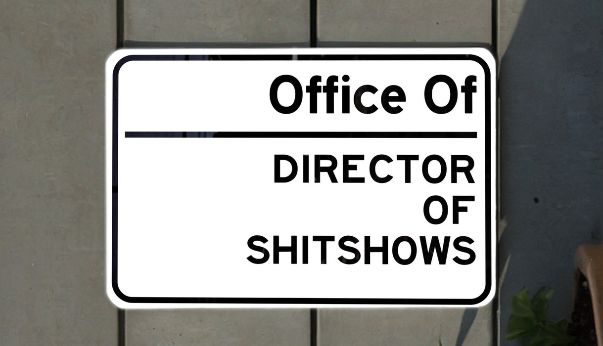 a white sign with black lettering on it