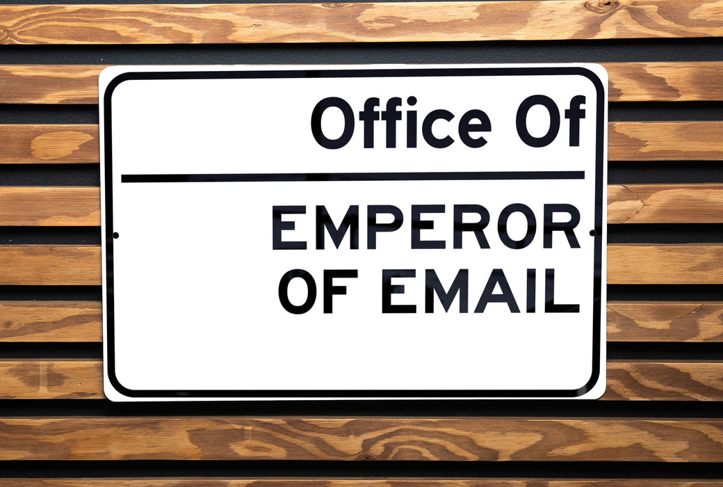 a white sign that is on a wooden bench