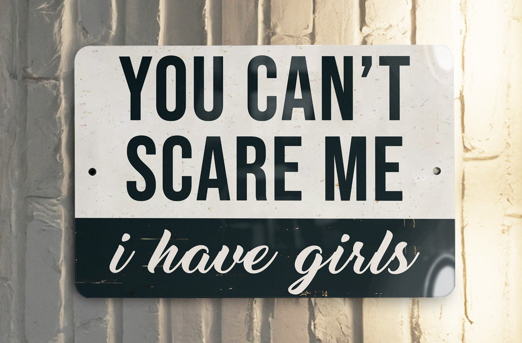 a black and white sign on a white wall