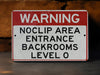 a red and white sign warning of nocip area entrance