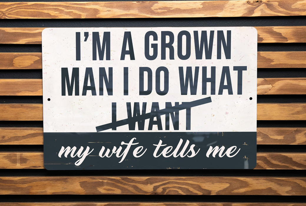 a street sign on a wooden wall