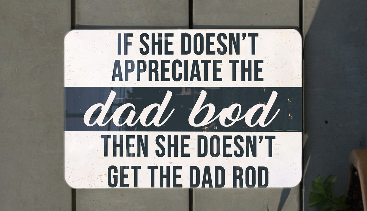 a white and black sign on a wooden wall