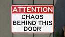 a red and white sign that says do not behind this sign