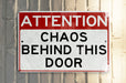 a red and white sign that reads do not enter behind this sign