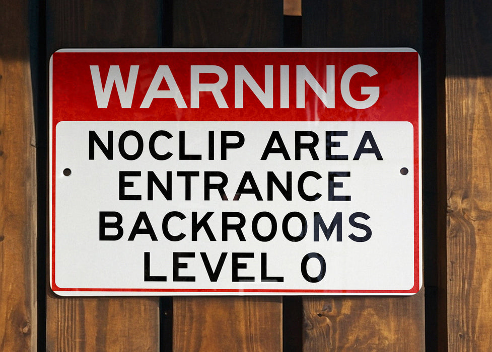 a red and white sign on a wooden fence