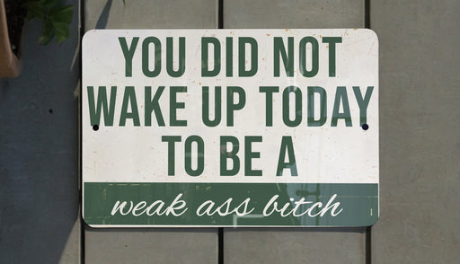 a green and white sign that says you did not wake up today to be a