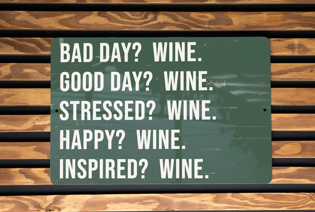 a green sign that says bad day? wine good day? wine stressed?