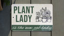 a sign that says plant lady is the new cat lady