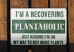 a green and white sign that says i'm a recovering plantaholic