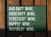 a green sign that says bad day? wine good day? wine stressed?