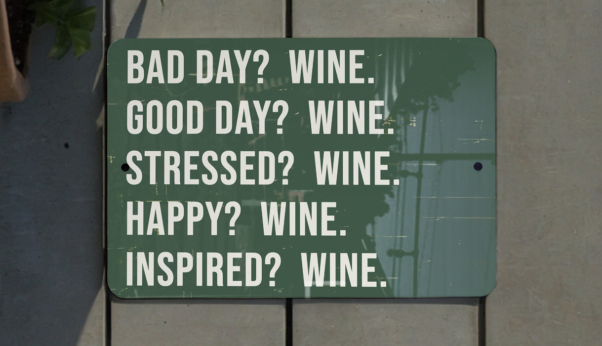 a green sign that says bad day? wine good day? wine stressed?