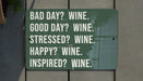 a green sign that says bad day? wine good day? wine stressed?