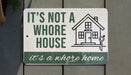 a sign that says it's not a house it's a home