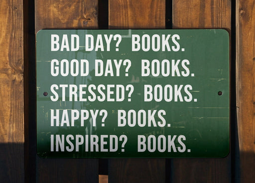 a green sign that says bad day? books good day? books stress? books