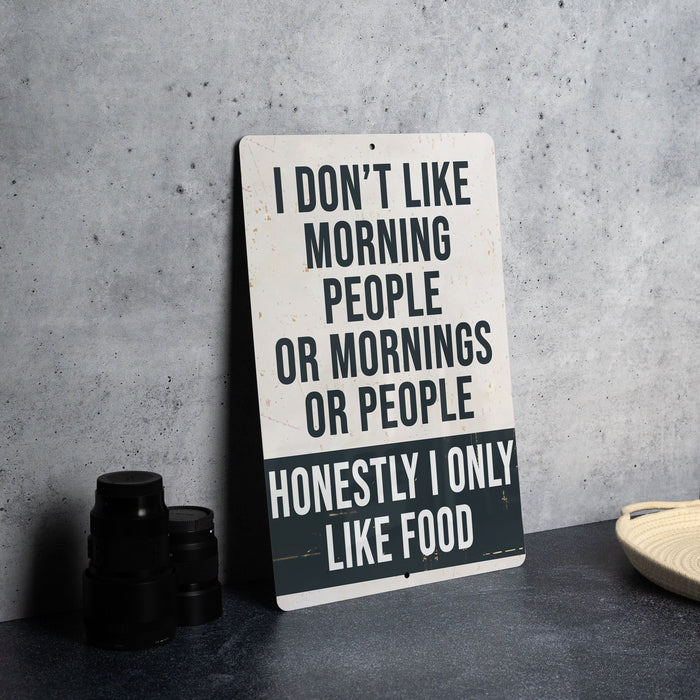 a sign sitting on top of a table next to a plate