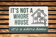 a sign that says it's not a house it's a home