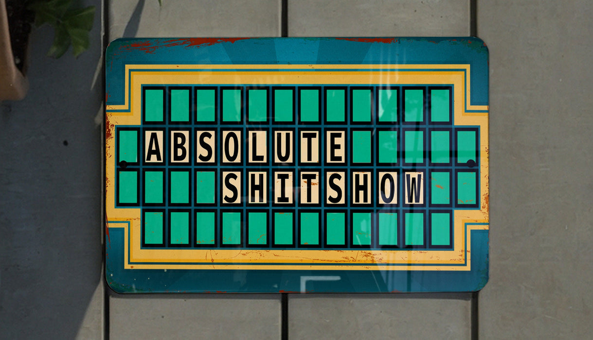 a sign that says absolute shit show on it