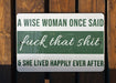 a sign that says a wise woman once said f k that shit and she lived