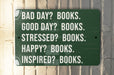 a green sign that says bad day? books good day? books stressed?