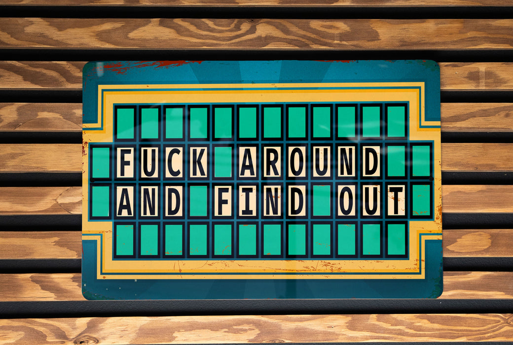 a close up of a sign on a wooden wall