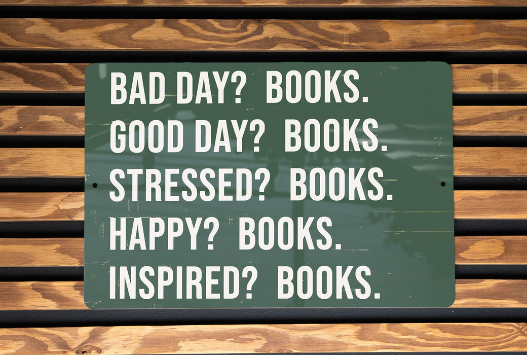 a green sign that says bad day? books good day? books stress? books
