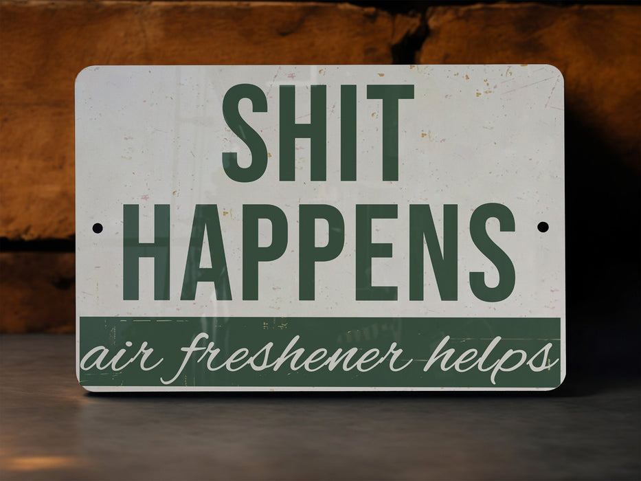 a sign that says shit happens air freshener helps