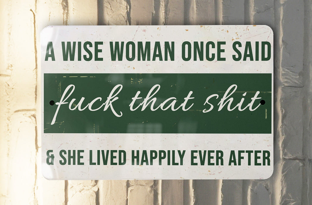 a green and white sign that says a wise woman once said f k that shit
