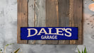 a blue sign that says dale's garage hanging on a wall