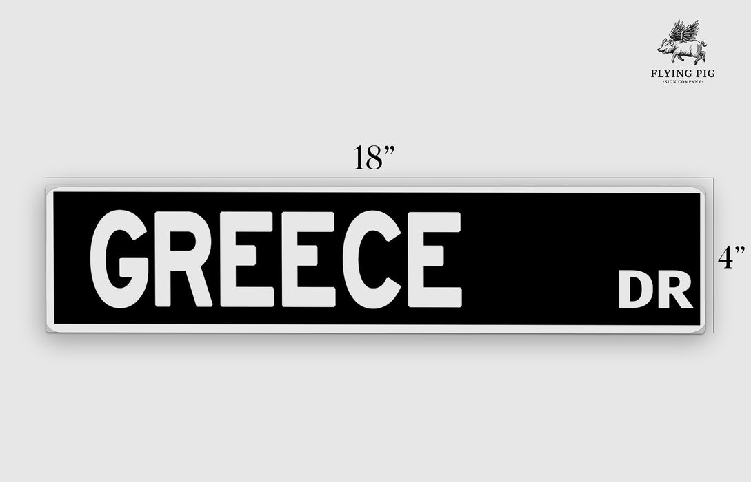 a black and white street sign that says greece