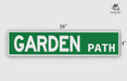a green street sign that says garden path