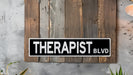a black and white sign that reads therapist blvd