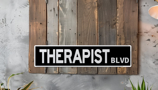 a black and white sign that reads therapist blvd