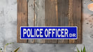 a police officer sign mounted to a wooden wall