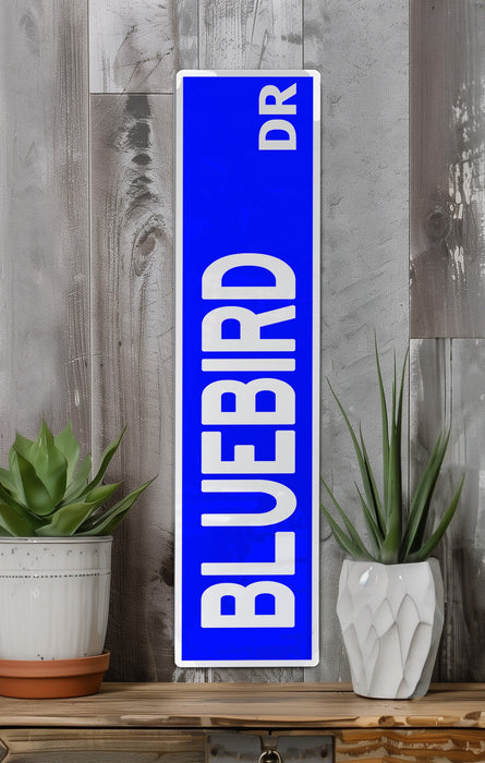 a blue sign sitting on top of a wooden shelf