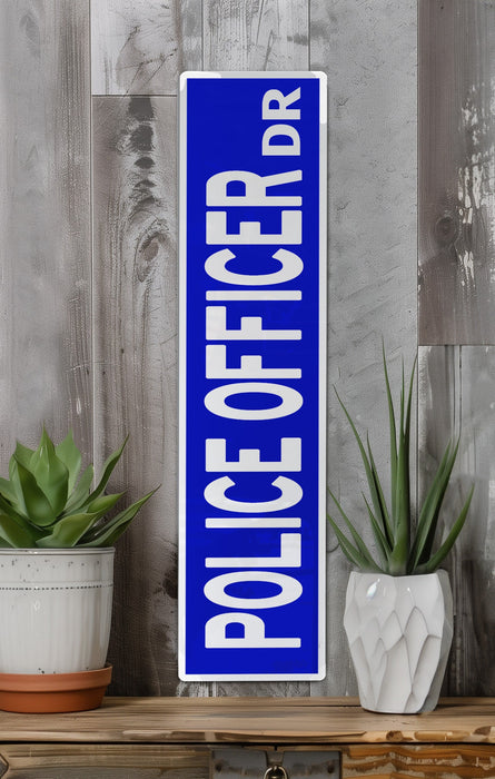 a blue sign sitting on top of a wooden shelf